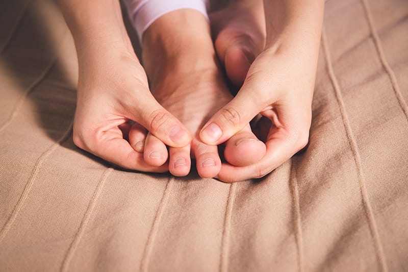 hands holding a foot